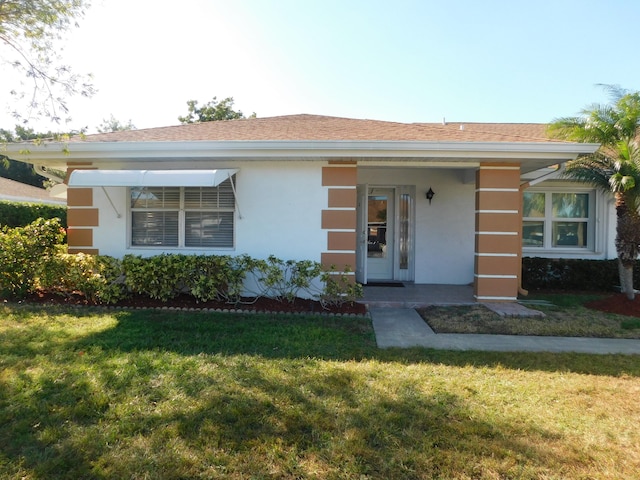 317 Colony Ln Unit A, Fort Pierce, FL 34982 - single story home with a front lawn and stucco siding