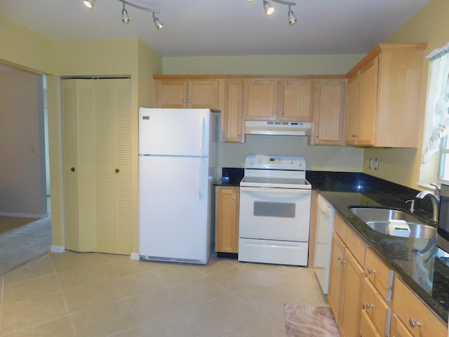 317 Colony Ln Unit A, Fort Pierce, FL 34982 - kitchen with white appliances, under cabinet range hood, a sink, dark stone countertops, and track lighting