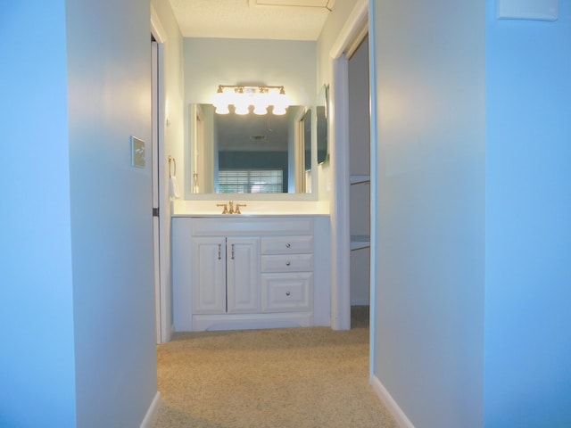317 Colony Ln Unit A, Fort Pierce, FL 34982 - hall with a sink, carpet flooring, and baseboards