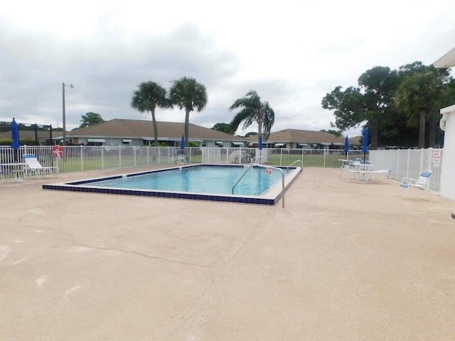317 Colony Ln Unit A, Fort Pierce, FL 34982 - community pool featuring a patio area and fence