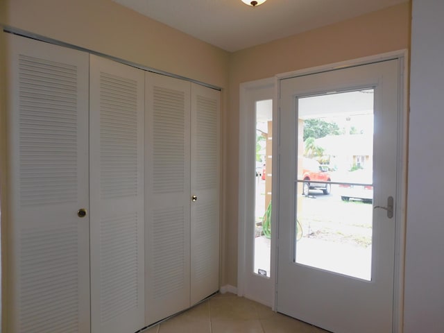 317 Colony Ln Unit A, Fort Pierce, FL 34982 - doorway with light tile patterned floors
