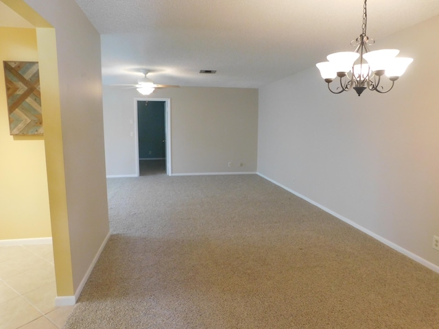 317 Colony Ln Unit A, Fort Pierce, FL 34982 - spare room with a chandelier, light carpet, baseboards, and a ceiling fan