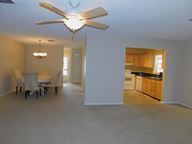 317 Colony Ln Unit A, Fort Pierce, FL 34982 - dining room featuring a chandelier, plenty of natural light, and light colored carpet