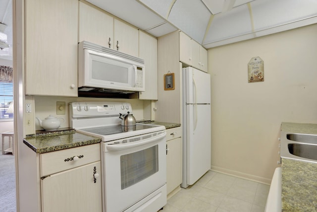 432 Grantham Unit B, Deerfield Beach, FL 33442 - kitchen with white appliances, baseboards, a sink, light tile patterned floors, and dark countertops