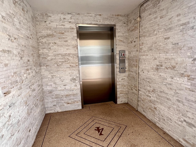 432 Grantham Unit B, Deerfield Beach, FL 33442 - hall with elevator and speckled floor