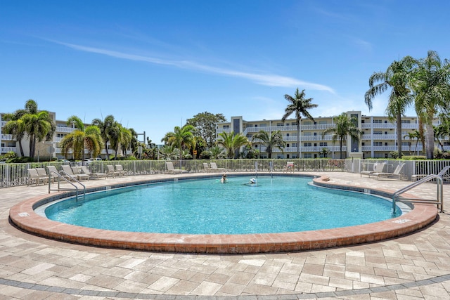 432 Grantham Unit B, Deerfield Beach, FL 33442 - community pool with fence and a patio area