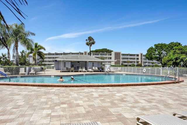 432 Grantham Unit B, Deerfield Beach, FL 33442 - community pool with fence and a patio area