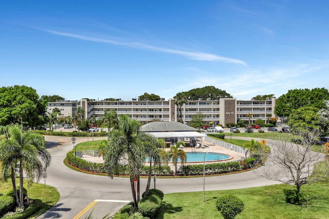 432 Grantham Unit B, Deerfield Beach, FL 33442 - surrounding community with a pool and curved driveway