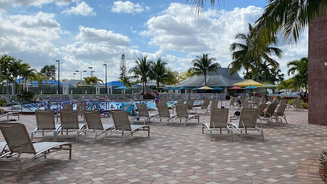 432 Grantham Unit B, Deerfield Beach, FL 33442 - view of patio / terrace with fence and a community pool