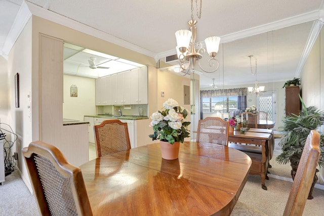 432 Grantham Unit B, Deerfield Beach, FL 33442 - dining space with a chandelier, crown molding, ceiling fan, and light colored carpet
