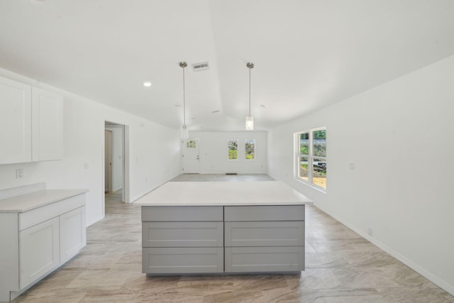 kitchen with visible vents, light countertops, marble finish floor, and gray cabinets