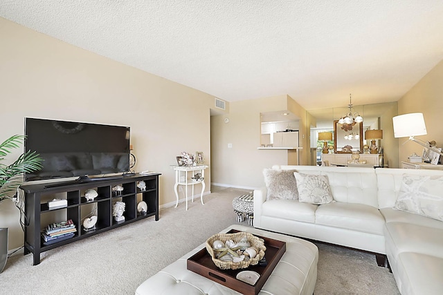 2121 N Ocean Blvd Unit 404W, Boca Raton, FL 33431 - carpeted living room with baseboards, an inviting chandelier, and visible vents
