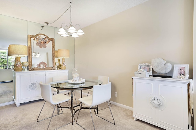 2121 N Ocean Blvd Unit 404W, Boca Raton, FL 33431 - dining space with baseboards, light carpet, and a chandelier