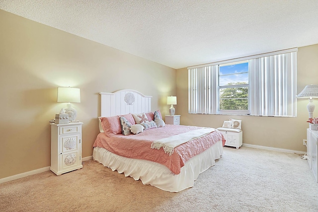2121 N Ocean Blvd Unit 404W, Boca Raton, FL 33431 - bedroom with baseboards, a textured ceiling, and light carpet