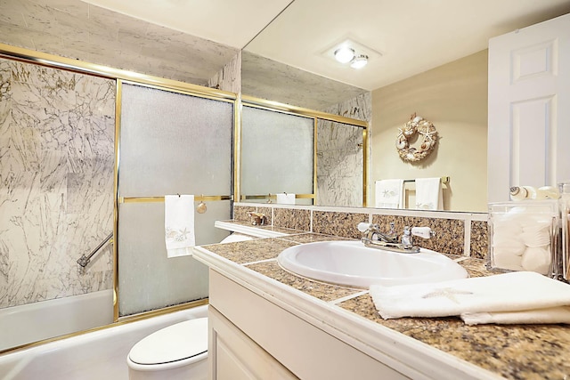 2121 N Ocean Blvd Unit 404W, Boca Raton, FL 33431 - bathroom with vanity, bath / shower combo with glass door, and toilet