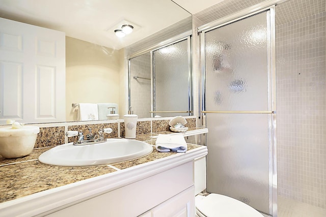 2121 N Ocean Blvd Unit 404W, Boca Raton, FL 33431 - bathroom with vanity, toilet, and a shower stall