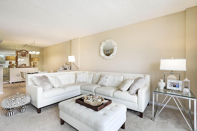 2121 N Ocean Blvd Unit 404W, Boca Raton, FL 33431 - living area featuring baseboards, a textured ceiling, and light carpet