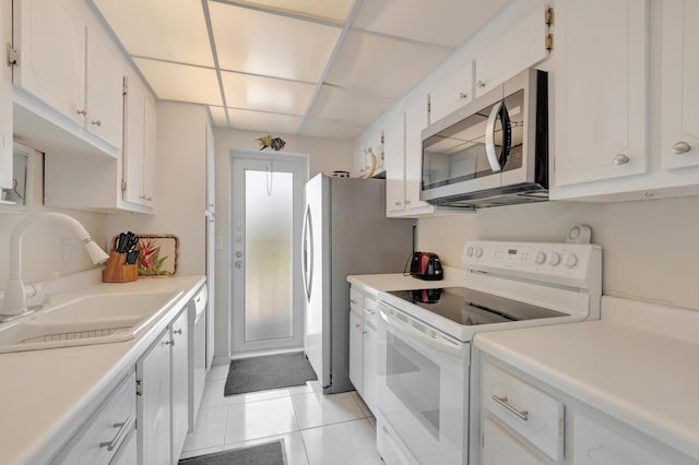 3101 S Ocean Blvd Unit 220, Highland Beach, FL 33487 - kitchen featuring white appliances, a sink, white cabinetry, and light tile patterned flooring