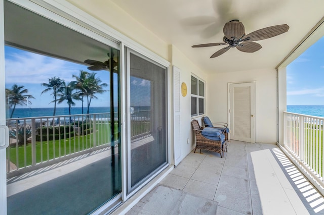 3101 S Ocean Blvd Unit 220, Highland Beach, FL 33487 - balcony with view of water and beach and ceiling fan