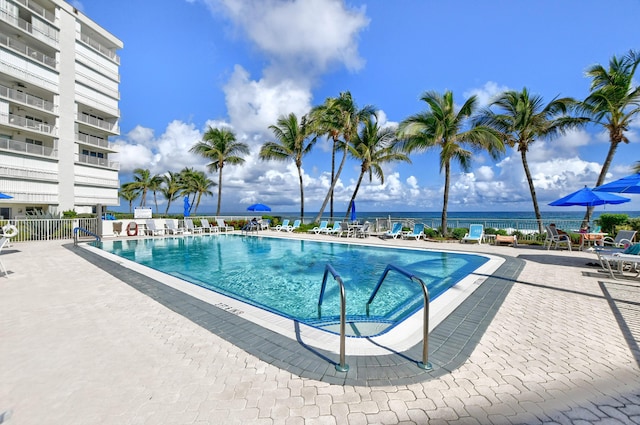 3101 S Ocean Blvd Unit 220, Highland Beach, FL 33487 - community pool featuring a patio and fence