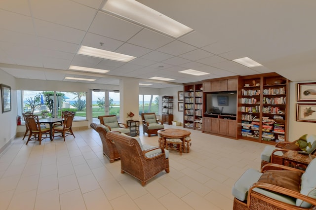 3101 S Ocean Blvd Unit 220, Highland Beach, FL 33487 - living area featuring a drop ceiling and light tile patterned floors