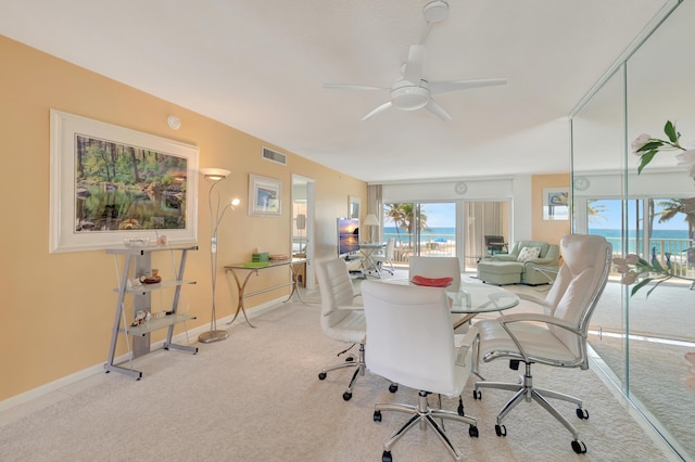3101 S Ocean Blvd Unit 220, Highland Beach, FL 33487 - dining room with carpet floors, a desk, a ceiling fan, and baseboards