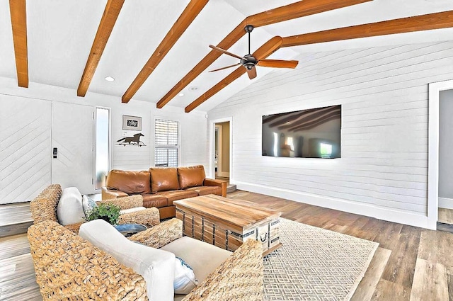 940 Turner Quay, Jupiter, FL 33458 - living area with vaulted ceiling with beams, ceiling fan, baseboards, and wood finished floors