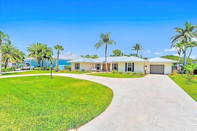 940 Turner Quay, Jupiter, FL 33458 - single story home featuring curved driveway, an attached garage, and a front yard
