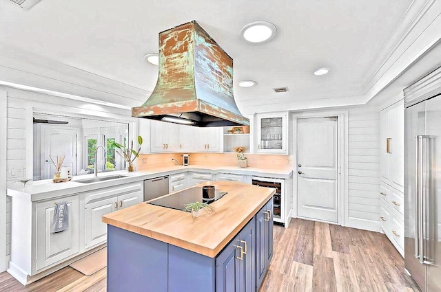 940 Turner Quay, Jupiter, FL 33458 - kitchen with wooden counters, blue cabinets, appliances with stainless steel finishes, a sink, and beverage cooler