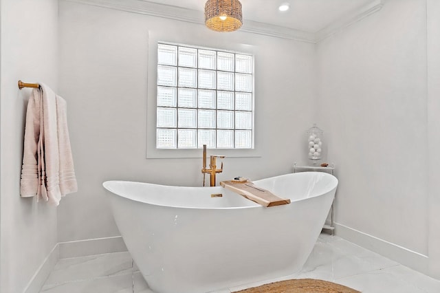 940 Turner Quay, Jupiter, FL 33458 - full bathroom featuring crown molding, baseboards, and a freestanding bath