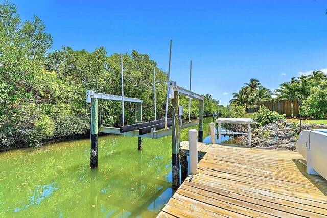940 Turner Quay, Jupiter, FL 33458 - view of dock with a water view, fence, and boat lift