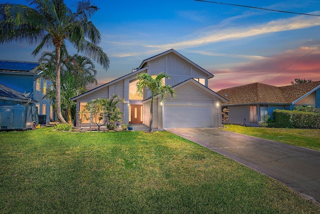 6089 Adams St, Jupiter, FL 33458 - view of front of home with concrete driveway, a front lawn, and a garage