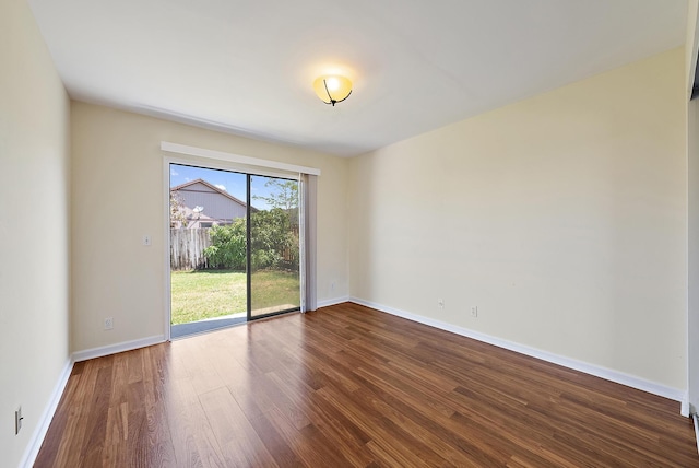 6089 Adams St, Jupiter, FL 33458 - unfurnished room with baseboards and dark wood-style floors