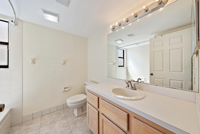 6089 Adams St, Jupiter, FL 33458 - full bath with vanity, toilet, visible vents, and tile patterned floors