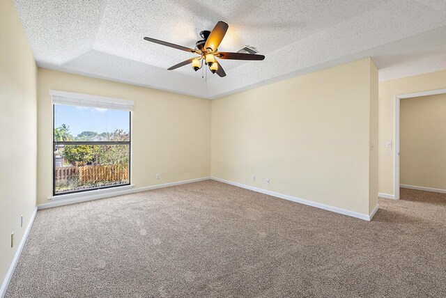 6089 Adams St, Jupiter, FL 33458 - empty room with a ceiling fan, a textured ceiling, baseboards, and carpet