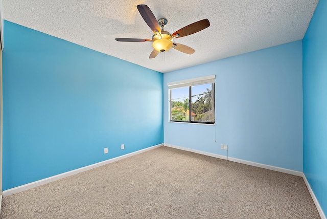 6089 Adams St, Jupiter, FL 33458 - carpeted spare room featuring baseboards, ceiling fan, and a textured ceiling
