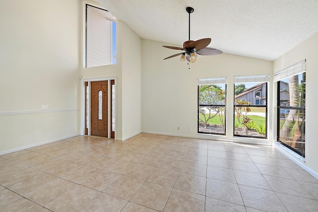 6089 Adams St, Jupiter, FL 33458 - interior space with light tile patterned flooring, a textured ceiling, vaulted ceiling, and a ceiling fan