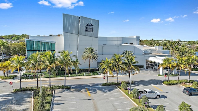 6089 Adams St, Jupiter, FL 33458 - view of building exterior featuring uncovered parking
