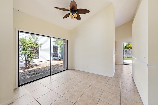 6089 Adams St, Jupiter, FL 33458 - spare room featuring a ceiling fan, a wealth of natural light, light tile patterned flooring, and high vaulted ceiling