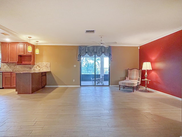 interior space featuring open floor plan, visible vents, a ceiling fan, a peninsula, and crown molding