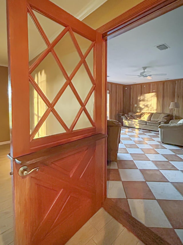 interior space with visible vents and wood walls