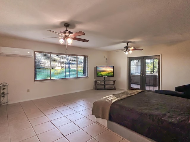 bedroom featuring light tile patterned flooring, an AC wall unit, access to outside, and multiple windows