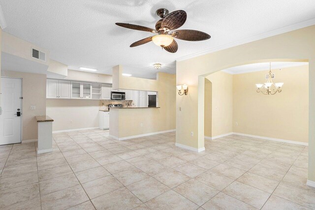 3211 Tuscany Way, Boynton Beach, FL 33435 - unfurnished living room with a textured ceiling, arched walkways, a chandelier, a ceiling fan, and crown molding