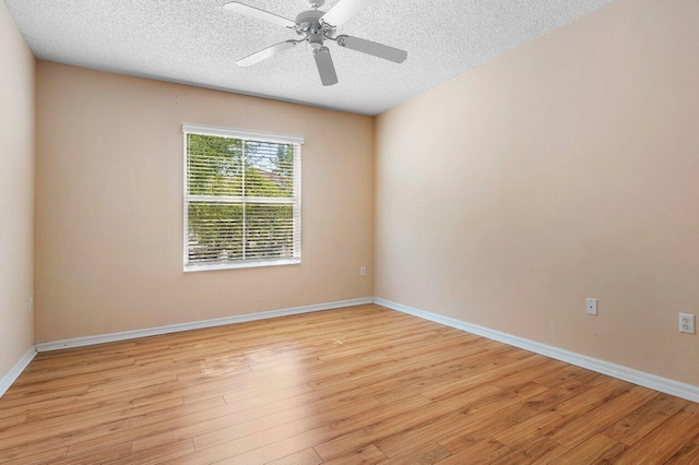 3211 Tuscany Way, Boynton Beach, FL 33435 - unfurnished room with a textured ceiling, light wood-style flooring, a ceiling fan, and baseboards