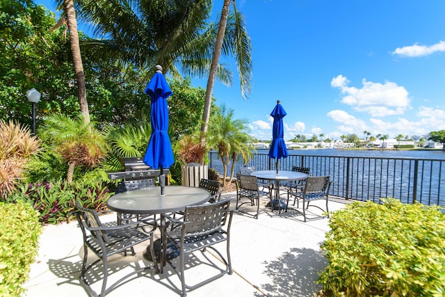 3211 Tuscany Way, Boynton Beach, FL 33435 - view of patio / terrace with outdoor dining space, area for grilling, and a water view