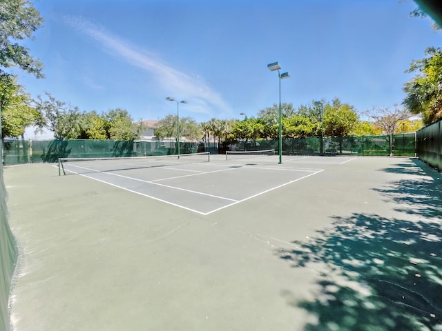 1023 Center Stone Ln, Riviera Beach, FL 33404 - view of tennis court featuring fence
