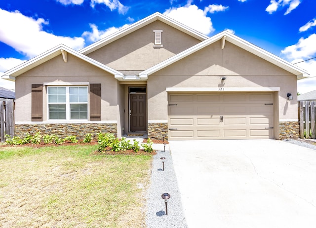 551 SW Lairo Ave, Port Saint Lucie, FL 34953 - single story home featuring stucco siding, driveway, an attached garage, and stone siding