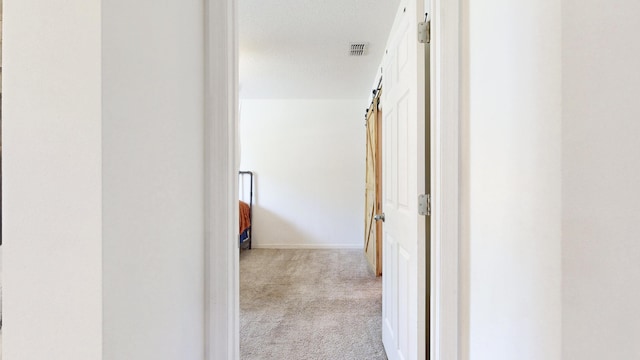 551 SW Lairo Ave, Port Saint Lucie, FL 34953 - corridor with visible vents, carpet floors, and baseboards