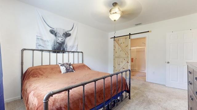 551 SW Lairo Ave, Port Saint Lucie, FL 34953 - bedroom featuring a barn door, light carpet, baseboards, visible vents, and a ceiling fan