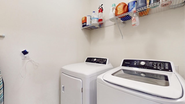 551 SW Lairo Ave, Port Saint Lucie, FL 34953 - clothes washing area with independent washer and dryer and laundry area